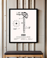 Wittman Regional Airport framed poster displayed in an airplane hangar
