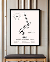 Brainerd Lakes Regional Airport framed poster displayed in an airplane hangar
