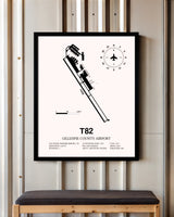 Gillespie County Airport framed poster displayed in an airplane hangar