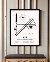 Sebastian Municipal Airport framed poster displayed in an airplane hangar