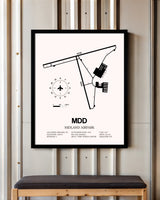 Midland Airpark framed poster displayed in an airplane hangar