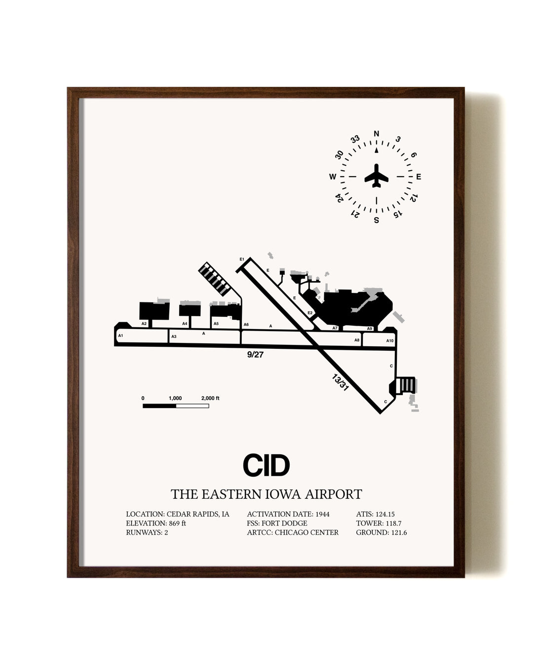 The Eastern Iowa Airport aviation print in walnut frame