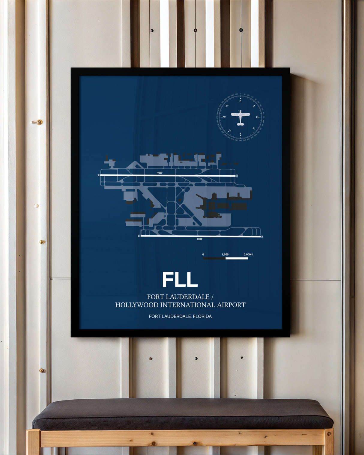 Fort Lauderdale/Hollywood International Airport framed poster displayed in an airplane hangar