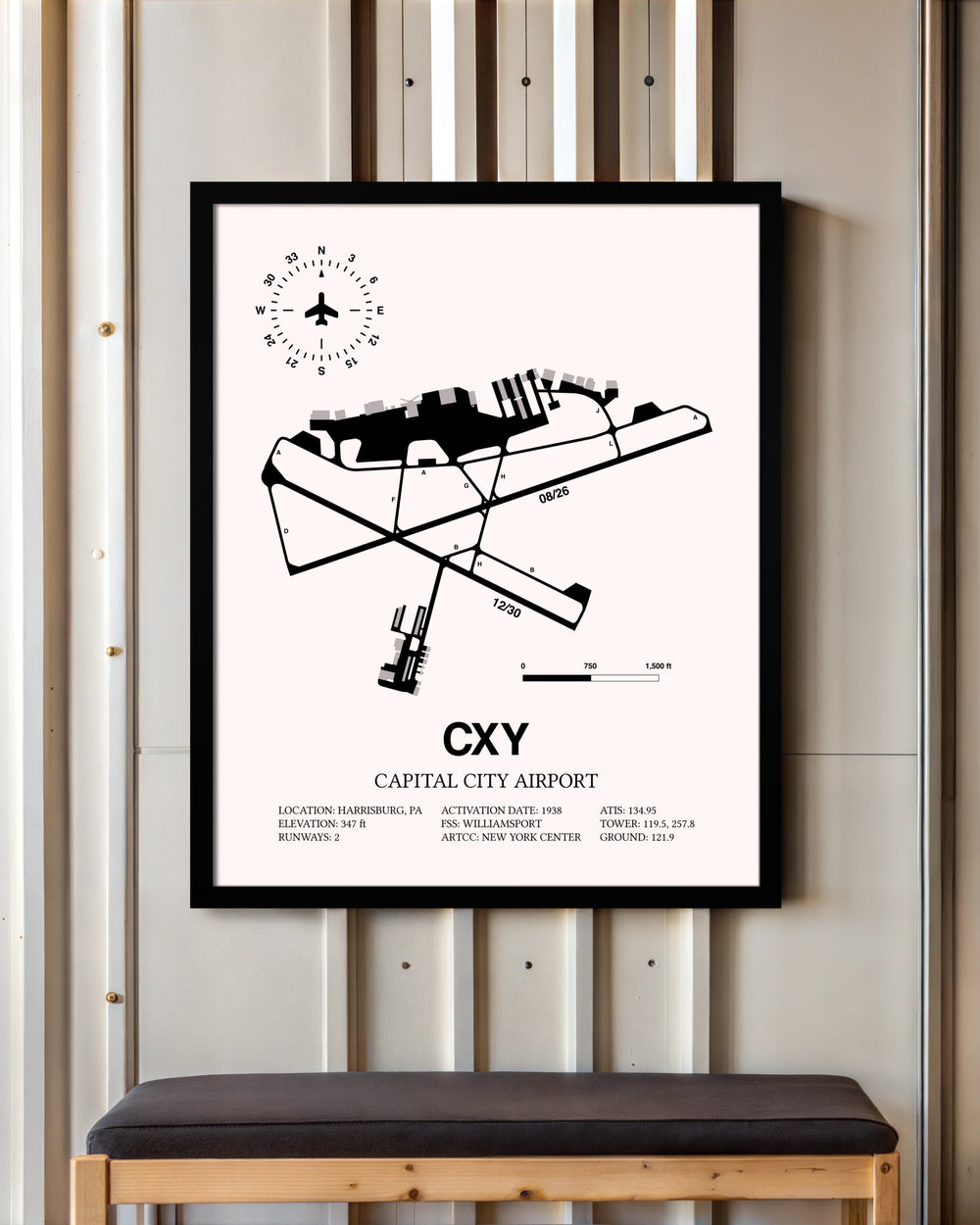 Capital City Airport framed poster displayed in an airplane hangar