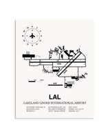 Gray Lakeland Linder International Airport framed poster displayed in an airplane hangar