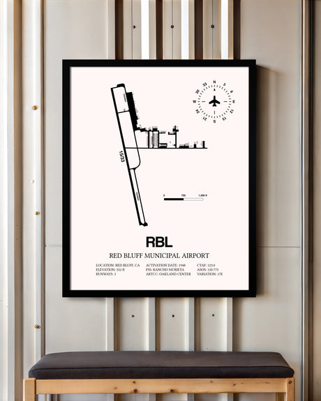Red Bluff Municipal Airport framed poster displayed in an airplane hangar