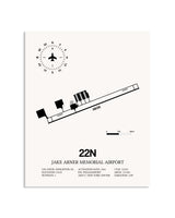 Gray Jake Arner Memorial Airport framed poster displayed in an airplane hangar