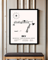 Brooksville-Tampa Bay Regional Airport framed poster displayed in an airplane hangar