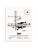 Gray South Bend International Airport framed poster displayed in an airplane hangar