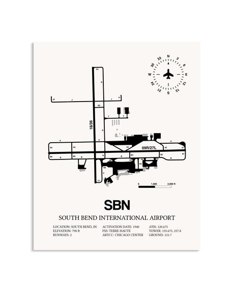 Gray South Bend International Airport framed poster displayed in an airplane hangar