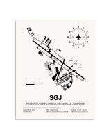 Gray Northeast Florida Regional Airport framed poster displayed in an airplane hangar