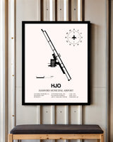Hanford Municipal Airport framed poster displayed in an airplane hangar