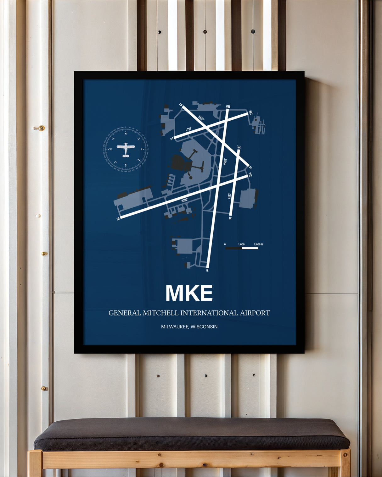 General Mitchell International Airport framed poster displayed in an airplane hangar