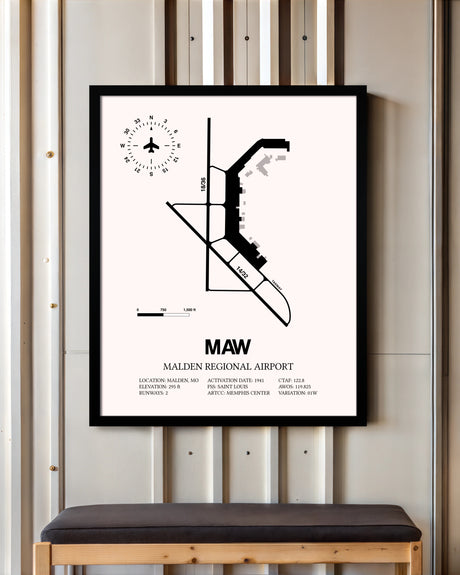 Malden Regional Airport framed poster displayed in an airplane hangar