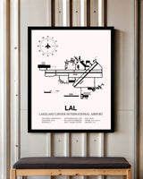 Lakeland Linder International Airport framed poster displayed in an airplane hangar