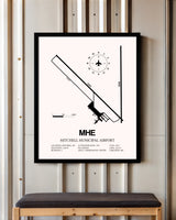 Mitchell Municipal Airport framed poster displayed in an airplane hangar