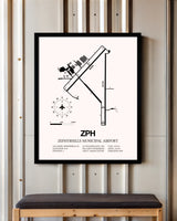 Zephyrhills Municipal Airport framed poster displayed in an airplane hangar