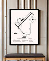 Williston Regional Airport framed poster displayed in an airplane hangar