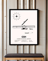 Goshen Municipal Airport framed poster displayed in an airplane hangar