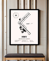 Brookhaven Airport framed poster displayed in an airplane hangar
