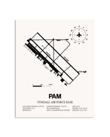 Gray Tyndall Air Force Base framed poster displayed in an airplane hangar