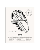 Gray St. Paul Downtown Airport Holman Field framed poster displayed in an airplane hangar
