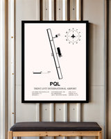 Trent Lott International Airport framed poster displayed in an airplane hangar