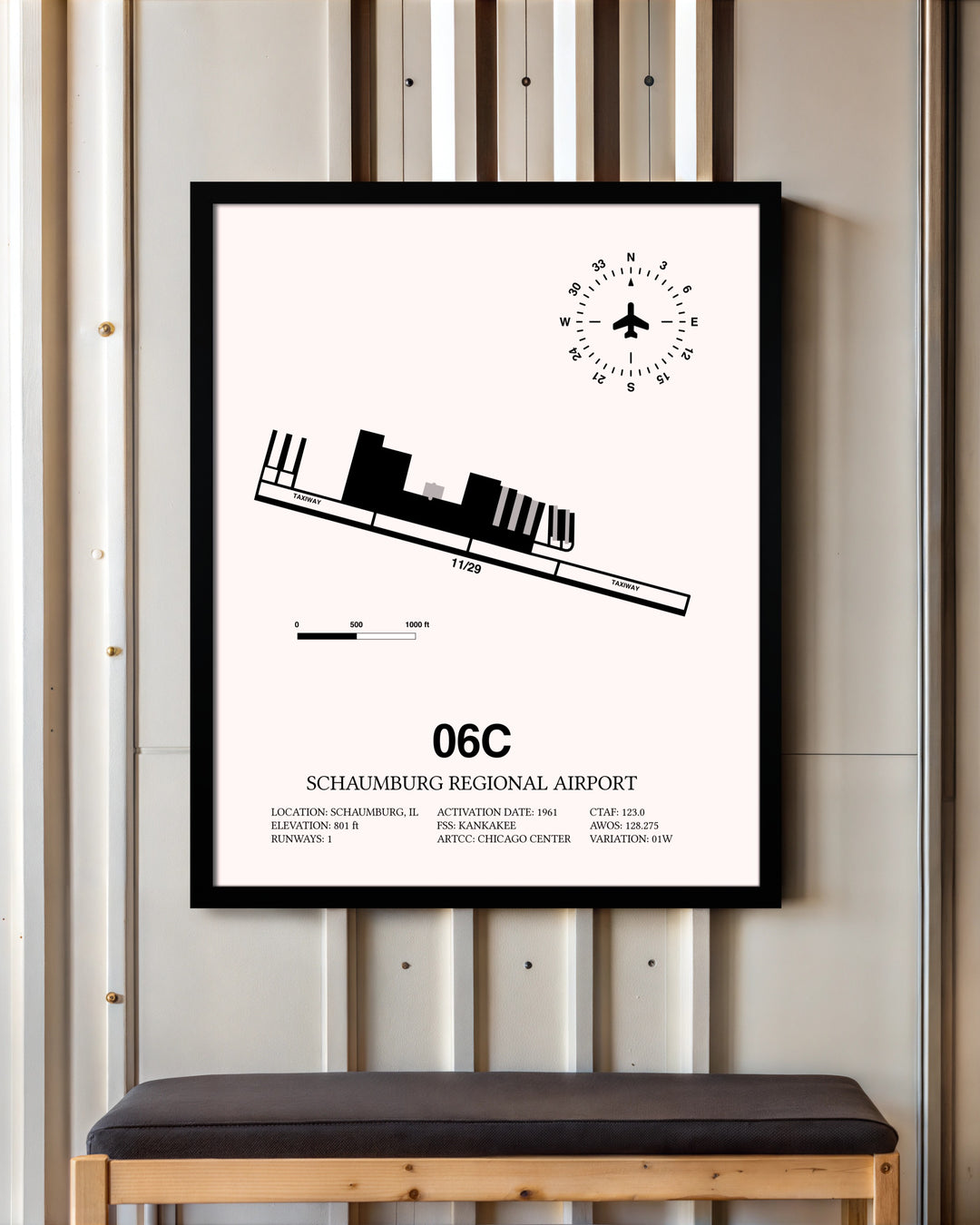 Schaumburg Regional Airport framed poster displayed in an airplane hangar