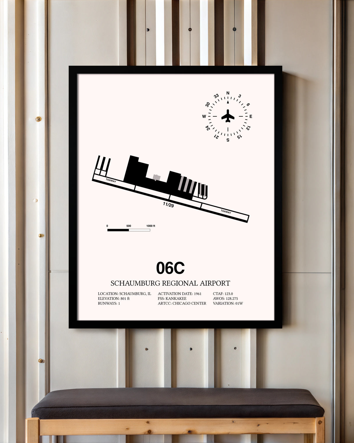 Schaumburg Regional Airport framed poster displayed in an airplane hangar