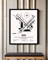 Baton Rouge Metropolitan Airport (Ryan Field) framed poster displayed in an airplane hangar
