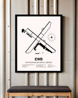 New Bedford Regional Airport framed poster displayed in an airplane hangar