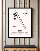 Stephenville Clark Regional Airport framed poster displayed in an airplane hangar