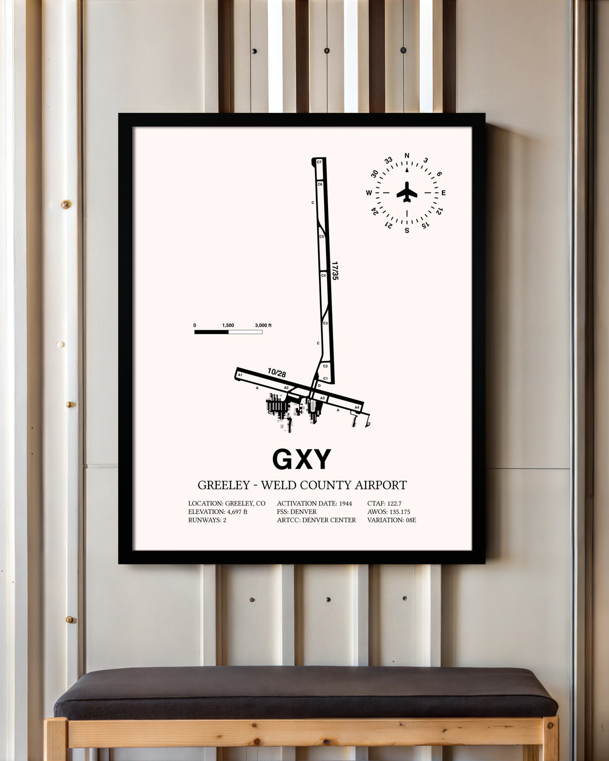 Greeley-Weld County Airport framed poster displayed in an airplane hangar