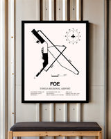 Topeka Regional Airport framed poster displayed in an airplane hangar
